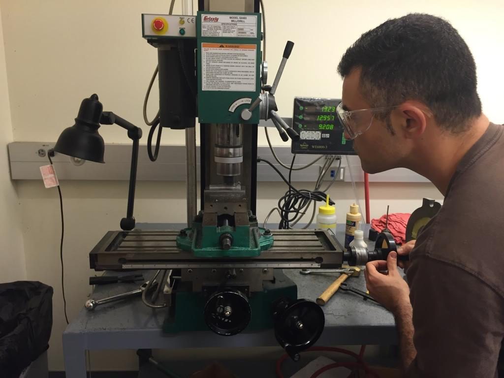 Arie working at a milling machine in his workshop