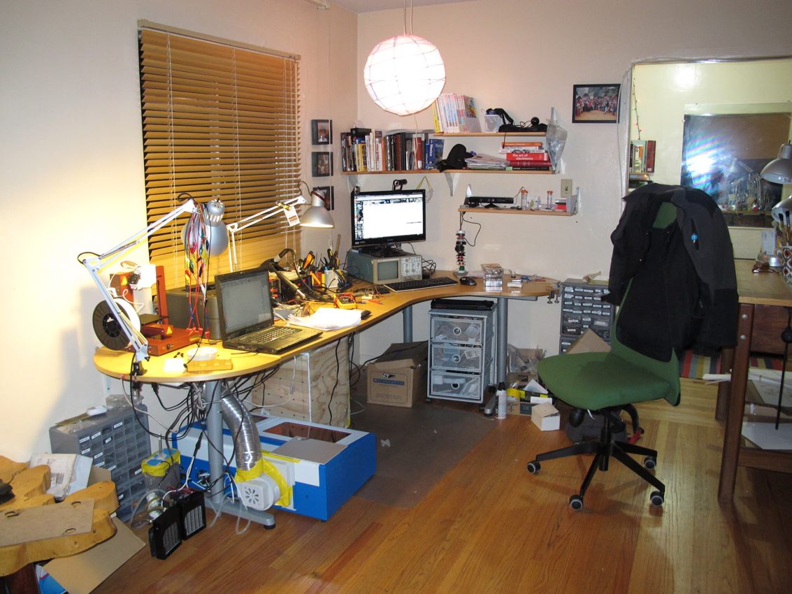 Arie’s working space with a milling machine, electronics, hand tools, and a computer